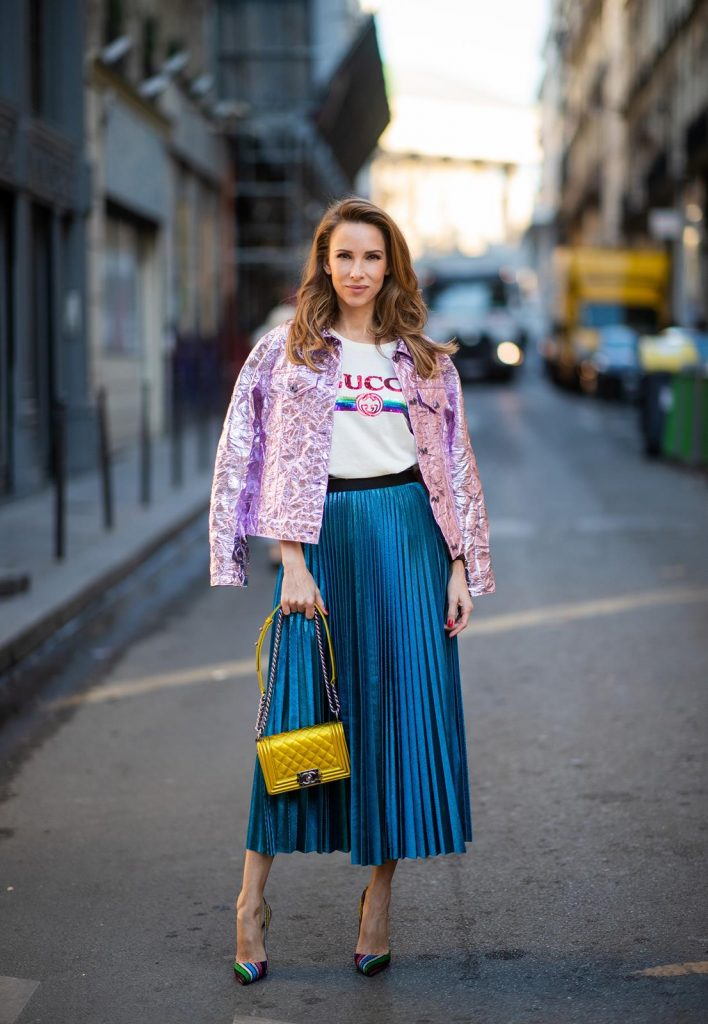 Sies Marjan, ROQA, Gucci, Chanel, Christian Louboutin, Céline Alexandra Lapp in a Metallic Fashion look, wearing the crinkled Alby laminated jacket from Sies Marjan, a pleated metallic skirt from ROQA in turquoise, a white logo print Gucci t-shirt, Chanel Boy bag in gold, Audrey sunglasses from Celine during Paris Fashion Week Womenswear Fall/Winter 2019/2020 on February 25, 2019 in Paris, France. (Photo by Christian Vierig/Getty Images)