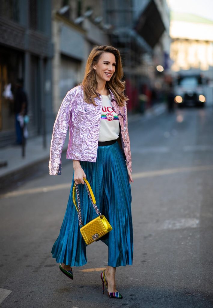 Sies Marjan, ROQA, Gucci, Chanel, Christian Louboutin, Céline Alexandra Lapp in a Metallic Fashion look, wearing the crinkled Alby laminated jacket from Sies Marjan, a pleated metallic skirt from ROQA in turquoise, a white logo print Gucci t-shirt, Chanel Boy bag in gold, Audrey sunglasses from Celine during Paris Fashion Week Womenswear Fall/Winter 2019/2020 on February 25, 2019 in Paris, France. (Photo by Christian Vierig/Getty Images)