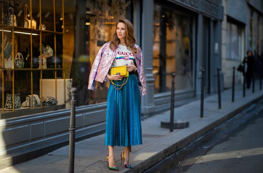 Sies Marjan, ROQA, Gucci, Chanel, Christian Louboutin, Céline Alexandra Lapp in a Metallic Fashion look, wearing the crinkled Alby laminated jacket from Sies Marjan, a pleated metallic skirt from ROQA in turquoise, a white logo print Gucci t-shirt, Chanel Boy bag in gold, Audrey sunglasses from Celine during Paris Fashion Week Womenswear Fall/Winter 2019/2020 on February 25, 2019 in Paris, France. (Photo by Christian Vierig/Getty Images)
