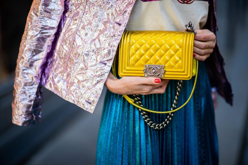 Sies Marjan, ROQA, Gucci, Chanel, Christian Louboutin, Céline Alexandra Lapp in a Metallic Fashion look, wearing the crinkled Alby laminated jacket from Sies Marjan, a pleated metallic skirt from ROQA in turquoise, a white logo print Gucci t-shirt, Chanel Boy bag in gold, Audrey sunglasses from Celine during Paris Fashion Week Womenswear Fall/Winter 2019/2020 on February 25, 2019 in Paris, France. (Photo by Christian Vierig/Getty Images)