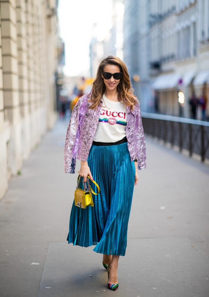 Sies Marjan, ROQA, Gucci, Chanel, Christian Louboutin, Céline Alexandra Lapp in a Metallic Fashion look, wearing the crinkled Alby laminated jacket from Sies Marjan, a pleated metallic skirt from ROQA in turquoise, a white logo print Gucci t-shirt, Chanel Boy bag in gold, Audrey sunglasses from Celine during Paris Fashion Week Womenswear Fall/Winter 2019/2020 on February 25, 2019 in Paris, France. (Photo by Christian Vierig/Getty Images)