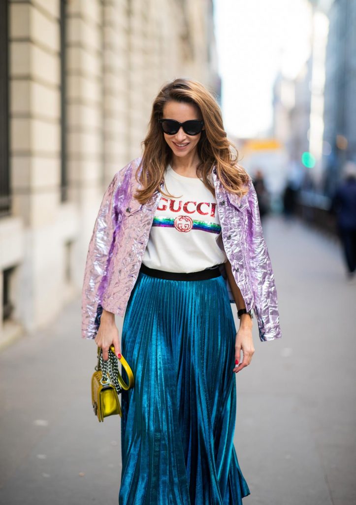 Sies Marjan, ROQA, Gucci, Chanel, Christian Louboutin, Céline Alexandra Lapp in a Metallic Fashion look, wearing the crinkled Alby laminated jacket from Sies Marjan, a pleated metallic skirt from ROQA in turquoise, a white logo print Gucci t-shirt, Chanel Boy bag in gold, Audrey sunglasses from Celine during Paris Fashion Week Womenswear Fall/Winter 2019/2020 on February 25, 2019 in Paris, France. (Photo by Christian Vierig/Getty Images)