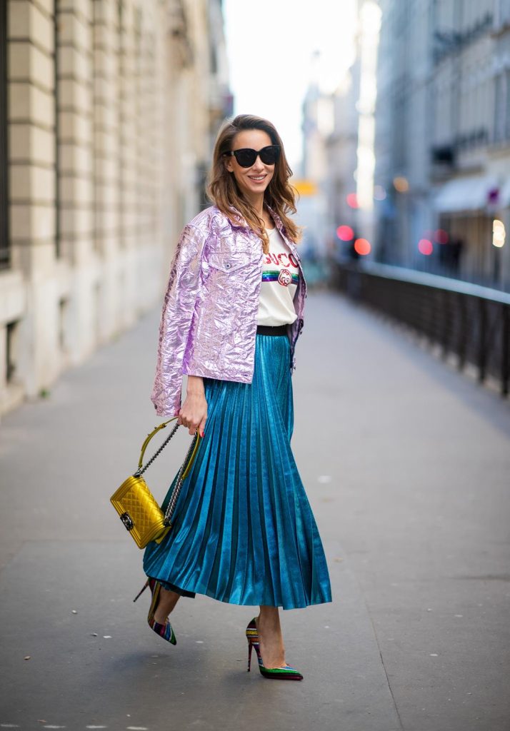 Sies Marjan, ROQA, Gucci, Chanel, Christian Louboutin, Céline Alexandra Lapp in a Metallic Fashion look, wearing the crinkled Alby laminated jacket from Sies Marjan, a pleated metallic skirt from ROQA in turquoise, a white logo print Gucci t-shirt, Chanel Boy bag in gold, Audrey sunglasses from Celine during Paris Fashion Week Womenswear Fall/Winter 2019/2020 on February 25, 2019 in Paris, France. (Photo by Christian Vierig/Getty Images)