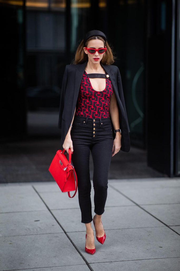 Alexandra Lapp in a Prada Bodysuit look wearing the SS19 black and red Prada Jacquard Jersey Body, black satin headband by Prada, red Hermes Kelly bag, red Cat-eye Celine sunglasses, Saint Laurent black classic jacket, Veronica Beard Debbie jeans in black on May 03, 2019 in Duesseldorf, Germany. (Photo by Christian Vierig/Getty Images)