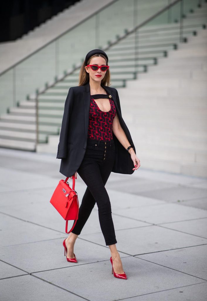 Alexandra Lapp in a Prada Bodysuit look wearing the SS19 black and red Prada Jacquard Jersey Body, black satin headband by Prada, red Hermes Kelly bag, red Cat-eye Celine sunglasses, Saint Laurent black classic jacket, Veronica Beard Debbie jeans in black on May 03, 2019 in Duesseldorf, Germany. (Photo by Christian Vierig/Getty Images)