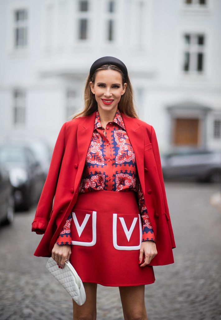 Alexandra Lapp in a Valentino Look, wearing a short red wool skirt with the embroidered V Logo, with a matching long oversized blazer, a logo printed twill shirt in blue white and red- all from Valentino, a black silk satin headband from Prada on May 01, 2019 in Duesseldorf, Germany. (Photo by Christian Vierig/Getty Images)