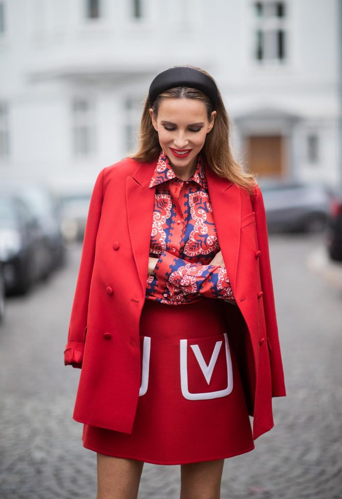Alexandra Lapp in a Valentino Look, wearing a short red wool skirt with the embroidered V Logo, with a matching long oversized blazer, a logo printed twill shirt in blue white and red- all from Valentino, a black silk satin headband from Prada on May 01, 2019 in Duesseldorf, Germany. (Photo by Christian Vierig/Getty Images)