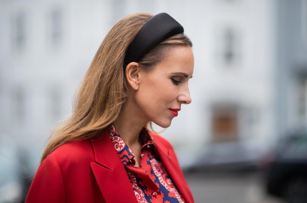 Alexandra Lapp in a Valentino Look, wearing a short red wool skirt with the embroidered V Logo, with a matching long oversized blazer, a logo printed twill shirt in blue white and red- all from Valentino, a black silk satin headband from Prada on May 01, 2019 in Duesseldorf, Germany. (Photo by Christian Vierig/Getty Images)