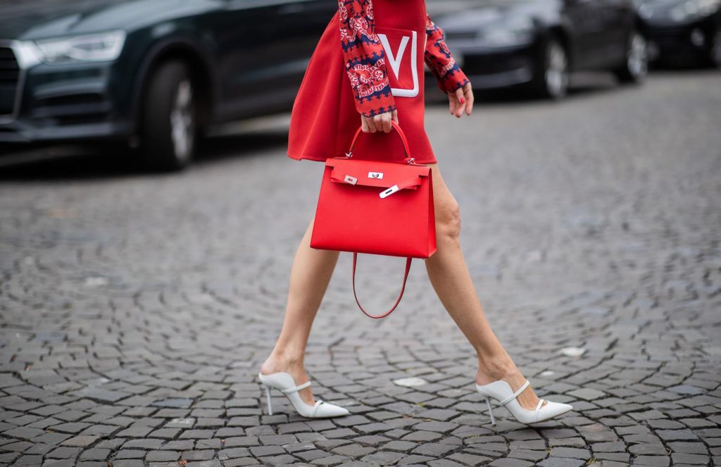 Alexandra Lapp in a Valentino Look, wearing a short red wool skirt with the embroidered V Logo, with a matching long oversized blazer, a logo printed twill shirt in blue white and red- all from Valentino, a black silk satin headband from Prada on May 01, 2019 in Duesseldorf, Germany. (Photo by Christian Vierig/Getty Images)
