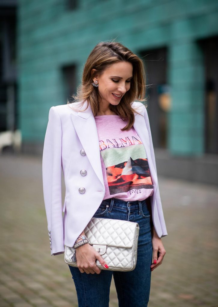 Alexandra Lapp in a Balenciaga Blazer look, wearing a pastel lilac double breasted blazer from Balenciaga, a pastel t-shirt with a logo print from Balmain, high rise skinny jeans Olivia from Citizens of Humanity, a vintage silver flap bag by Chanel and the Toubinana 80 Satin Cinestripes Multicolored Pumps from Christian Louboutin on May 01, 2019 in Duesseldorf, Germany. (Photo by Christian Vierig/Getty Images)