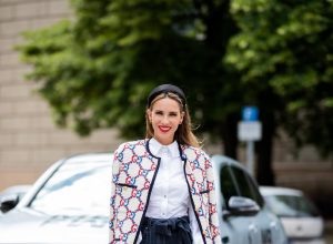 Alexandra Lapp in a Women and Technology look, is seen wearing a IWC Portofino Chronograph in front of a Mercedes EQC during MBFW Berlin.