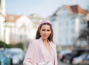 DUESSELDORF, GERMANY : Alexandra Lapp is seen wearing a monochrome look Riani, pink pleated dress, pink oversized blazer, white Chanel bag on December 11, 2019 in Duesseldorf, Germany. (Photo by Christian Vierig/Getty Images)
