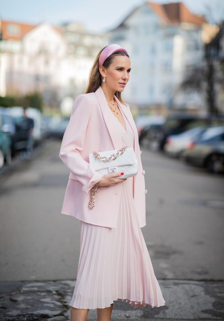DUESSELDORF, GERMANY : Alexandra Lapp is seen wearing a monochrome look Riani, pink pleated dress, pink oversized blazer, white Chanel bag on December 11, 2019 in Duesseldorf, Germany. (Photo by Christian Vierig/Getty Images)