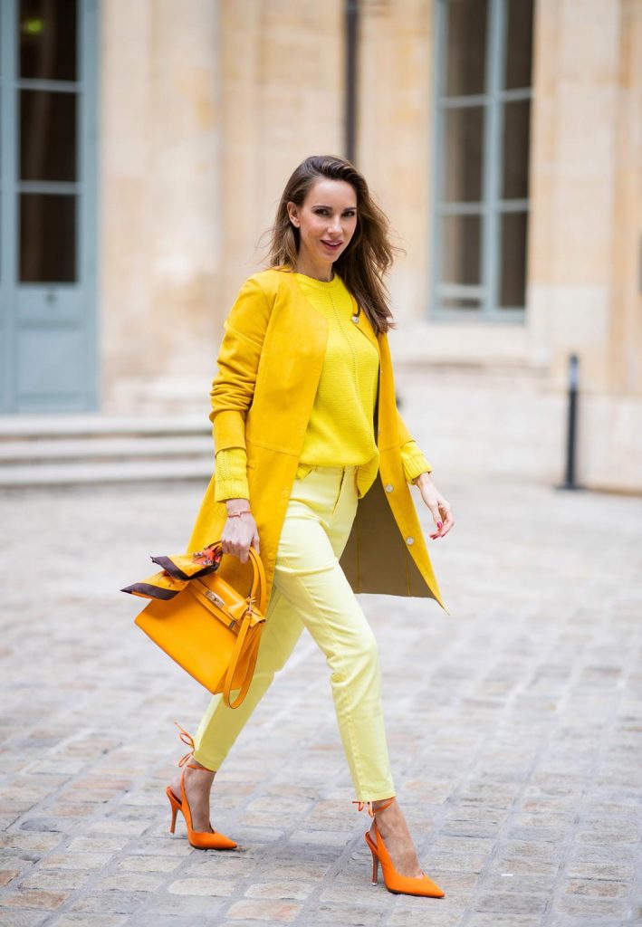 PARIS, FRANCE - FEBRUARY 26: Alexandra Lapp is seen wearing a yellow trend, leather coat in yellow from Milestone by Peter Hahn, yellow Looxent pullover from Peter Hahn, MYBC Jeans from Peter Hahn, slingback-pumps in orange from The Attico, 28 Hermes Kelly bag in orange, silk scarf from Hermes during Paris Fashion Week - Womenswear Fall/Winter 2020/2021 : Day Three on February 26, 2020 in Paris, France.