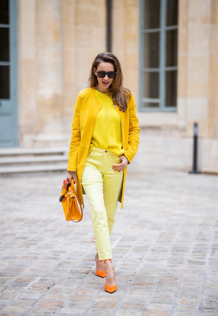 PARIS, FRANCE - FEBRUARY 26: Alexandra Lapp is seen wearing a yellow trend, leather coat in yellow from Milestone by Peter Hahn, yellow Looxent pullover from Peter Hahn, MYBC Jeans from Peter Hahn, slingback-pumps in orange from The Attico, 28 Hermes Kelly bag in orange, silk scarf from Hermes during Paris Fashion Week - Womenswear Fall/Winter 2020/2021 : Day Three on February 26, 2020 in Paris, France.