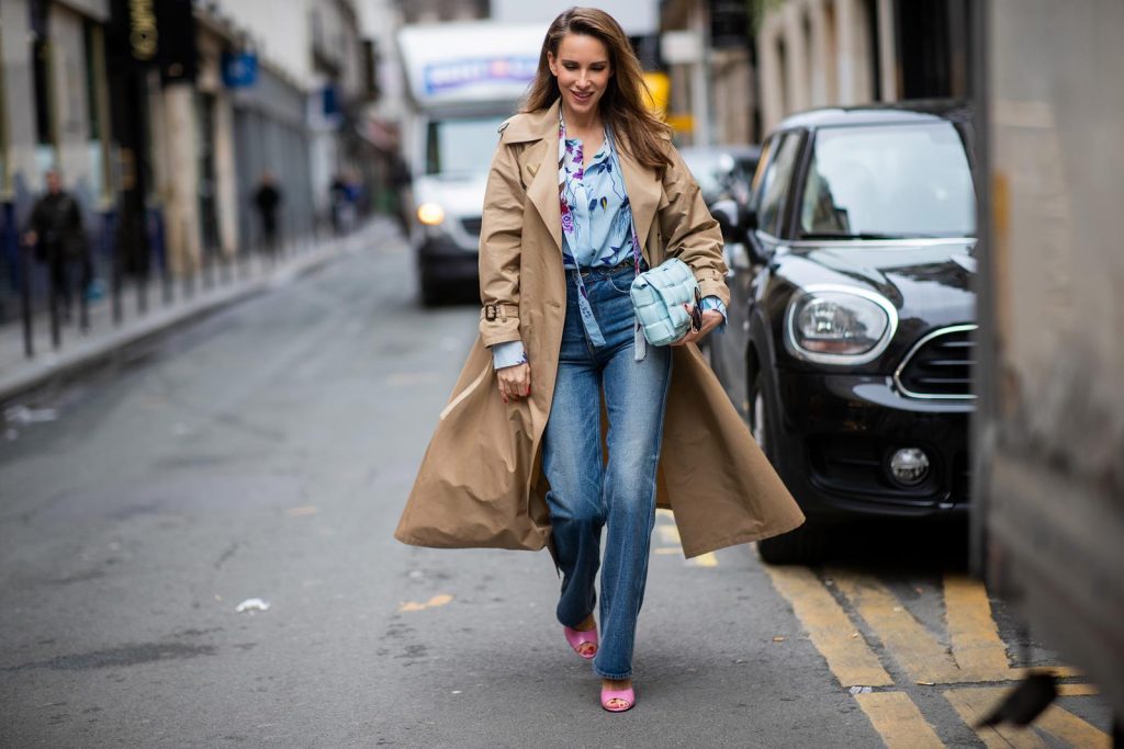PARIS, FRANCE - FEBRUARY 25: Alexandra Lapp is seen wearing Jeans Jane Flare from Celine, double breasted trench coat from Valentino, Stella McCartney blouse, Bottega Veneta Padded Cassette bag in leather in light blue, Bottega Veneta sunglasses - all from Breuninger during Paris Fashion Week - Womenswear Fall/Winter 2020/2021