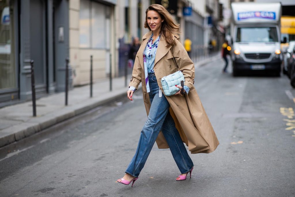 PARIS, FRANCE - FEBRUARY 25: Alexandra Lapp is seen wearing Jeans Jane Flare from Celine, double breasted trench coat from Valentino, Stella McCartney blouse, Bottega Veneta Padded Cassette leather bag in light blue, Bottega Veneta sunglasses - all from Breuninger during Paris Fashion Week - Womenswear Fall/Winter 2020/2021