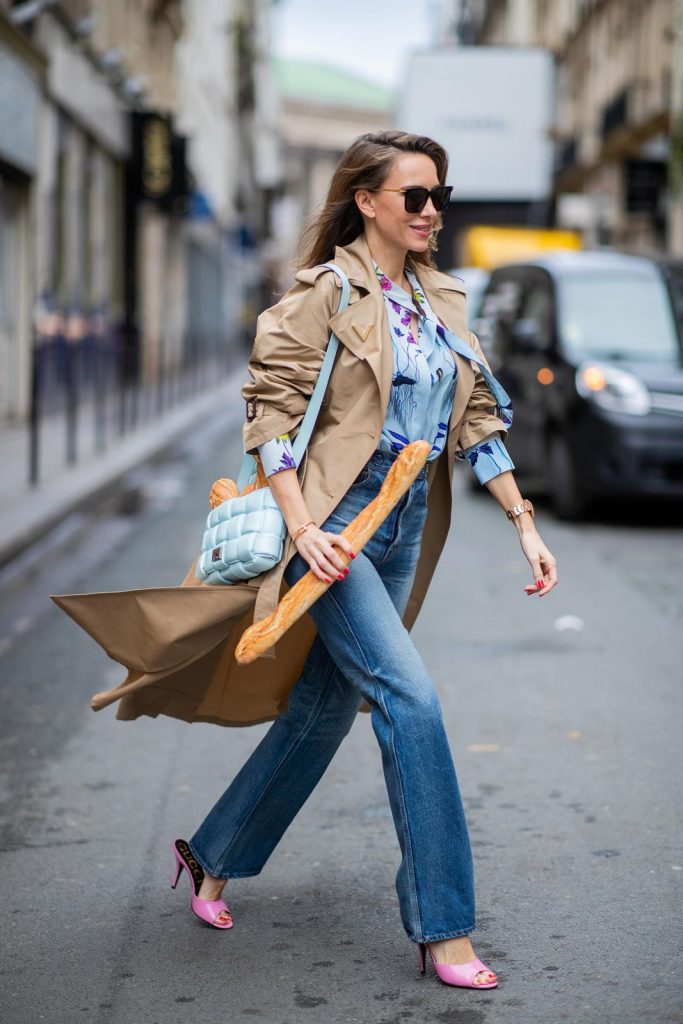 PARIS, FRANCE - FEBRUARY 25: Alexandra Lapp is seen wearing Jeans Jane Flare from Celine, double breasted trench coat from Valentino, Stella McCartney blouse, Bottega Veneta Padded Cassette leather bag in light blue, Bottega Veneta sunglasses - all from Breuninger during Paris Fashion Week - Womenswear Fall/Winter 2020/2021