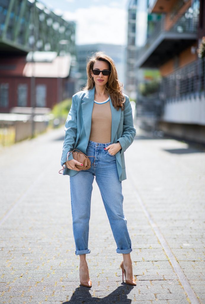 DUSSELDORF, GERMANY - JUNE 09: Alexandra Lapp is seen wearing a casual chic look, Victoria Beckham tanktop in beige, GRLFRND high waist Jeans Devon, double breasted blazer in blue from Low Classic, the Pouch mini clutch from Bottega Veneta and Dylan cat-eye sunglasses in black with silver all from NET-A-PORTER is seen on June 09, 2020 in Dusseldorf, Germany. 