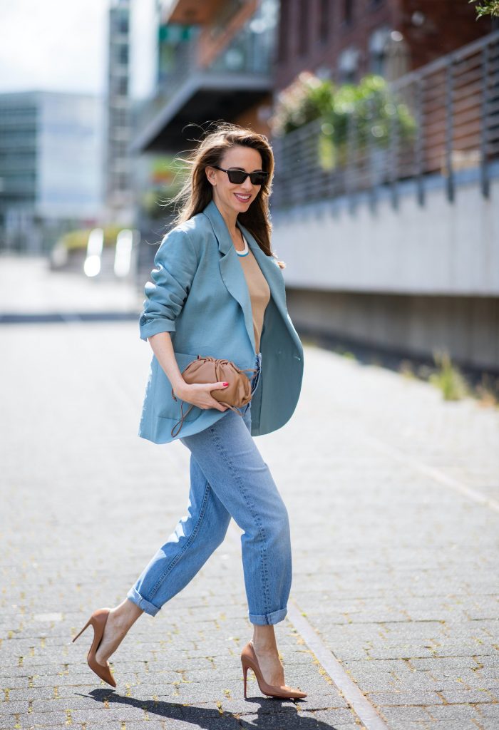 DUSSELDORF, GERMANY - JUNE 09: Alexandra Lapp is seen wearing a casual chic look, Victoria Beckham tanktop in beige, GRLFRND high waist Jeans Devon, double breasted blazer in blue from Low Classic, the Pouch mini clutch from Bottega Veneta and Dylan cat-eye sunglasses in black with silver all from NET-A-PORTER is seen on June 09, 2020 in Dusseldorf, Germany. 