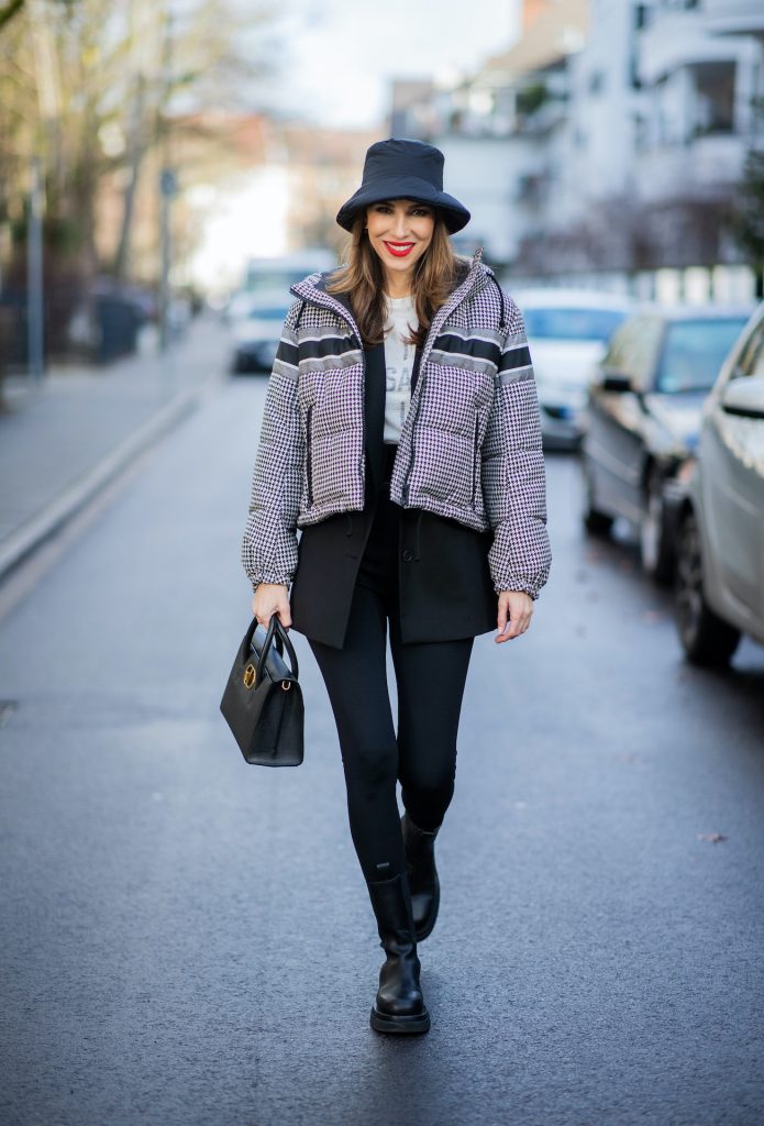 Alexandra Lapp is seen wearing one of her puffer jackets, CHRISTIAN DIOR puffer jacket in black and white, Zara puffer hat in Black, CHRISTIAN DIOR blazer in Black, CHRISTIAN DIOR t-shirt in white, CHRISTIAN DIOR St Honoré Tote bag in black.