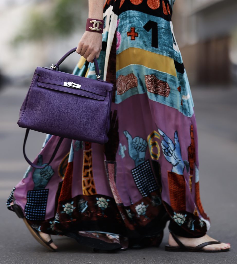 Alexandra Lapp. SuperBrands Secondhand, Maison Valentino, Hermès, Kelly bag, Bottega Veneta, Chanel, Christian Dior Alexandra Lapp is seen wearing Maison Valentino dress, Hermès silk scarf, Christian Dior necklace, Chanel ear clips and bracelet, Hermès Birkin Bag and Bottega Veneta sandals. Complete look by SuperBrands Secondhand.