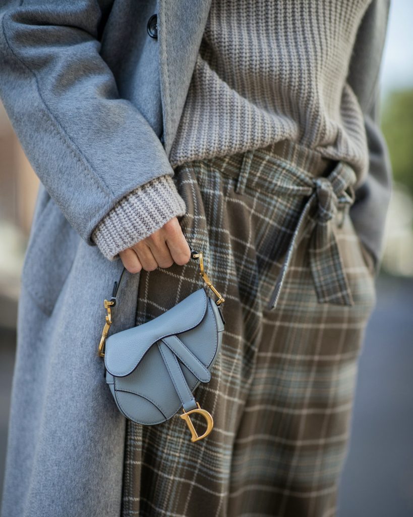 Alexandra Lapp, Shades of Grey, Autumn Favorites, Knitwear, Cashmere, Monochrome, Max Mara, Iris von Arnim, Celine, Veja, Christian Dior, Saddle Bag Alexandra Lapp is seen wearing a grey Max Mara cashmere coat, Christian Dior Saddle Micro bag, Iris von Arnim cashmere jumper, cashmere beanie, high waist pants, Celine sunglasses and Veja sneakers.