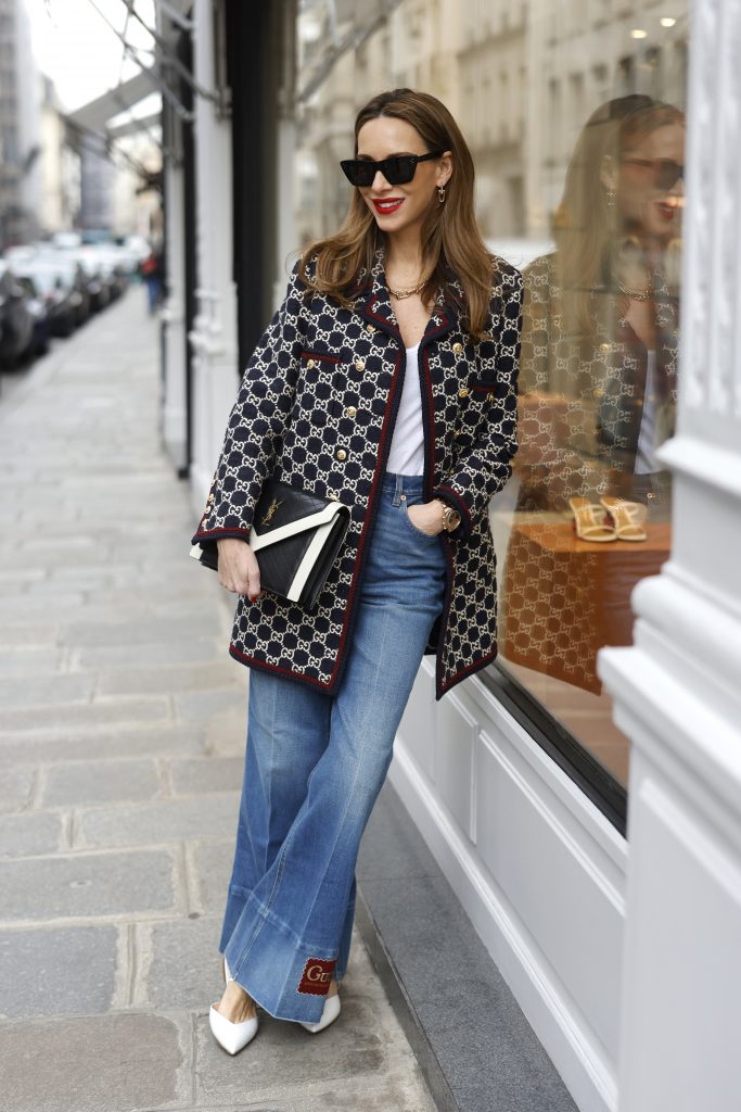 Alexandra Lapp, Gucci logo print, Chanel, Fendi, Celine, Agolde, Blazer, Jacket, Chanel, Saint Laurent, Streetstyle Shooters, Max Mara, Tiffany & Co., Saint Laurent, Gianvito Rossi, Aquazzura Alexandra Lapp is seen wearing the GUCCI logo print Caban Jacket in the Gucci pattern, JAMES PEARSE t-shirt in white, GUCCI washed denim flair trousers with Gucci label, GIANVITO ROSSI ribbon point flats in vitello white, SAINT LAURENT handbag in black and white, and BOTTEGA VENETA square acetate sunglasses in black. Complete look by Breuninger.