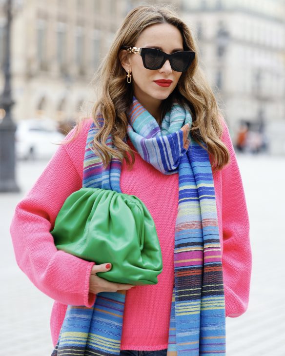 Alexandra Lapp is seen wearing her Winter highlights during Paris Fashion Week, such as coats, chunky knits, statement ear rings and accessories, as well as her signature make-up.