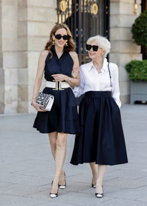 Alexandra Lapp is seen wearing Alexandra Lapp x Seidensticker capsule collection Black Sleeveless Taft Dress, White Triacetat Blouse, and Black Taft Midi Skirt in Paris, Summer 2024.