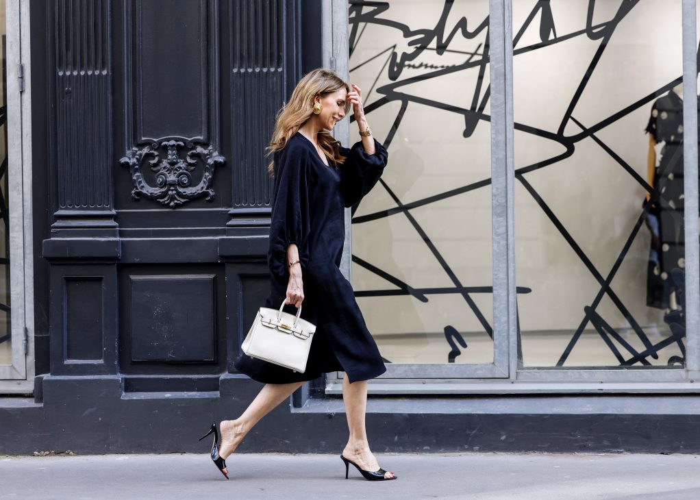 Alexandra Lapp is seen wearing Alexandra Lapp x Seidensticker capsule collection Black Linen Mix Dress, and Wild Aster Linen Mix Dress in Paris, Summer 2024.